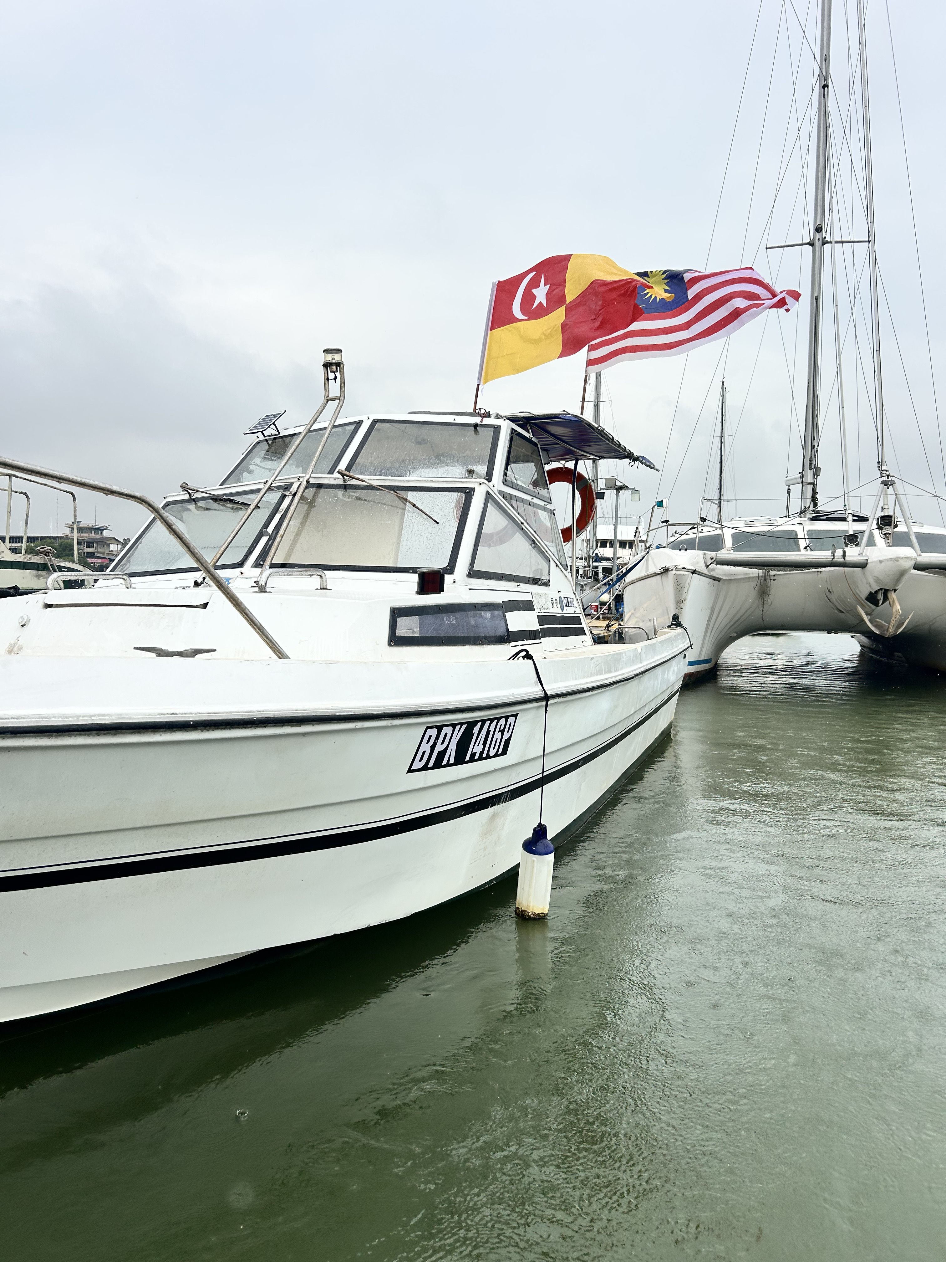 Boat with flags at dock